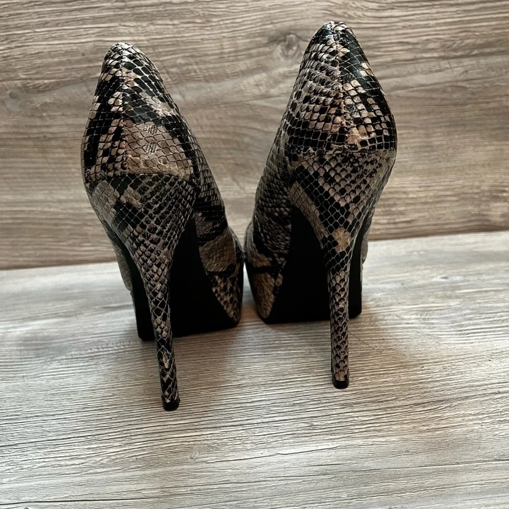 Olsenboye tall platform snakeskin patterned high heels. Closed toe size 9